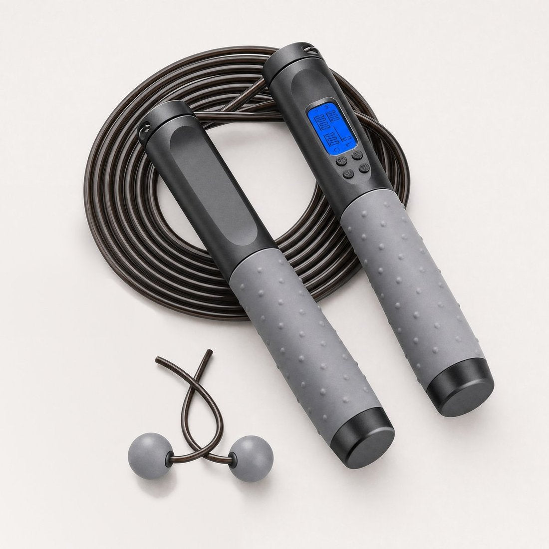 Counting jump rope with LCD counter handle, adjustable cable and cordless weighted balls